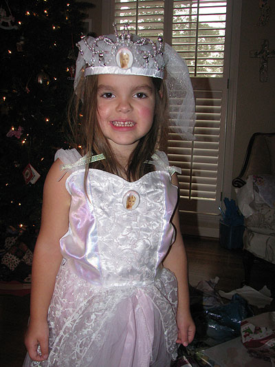 Her favorite gift, a princess wedding gown and crown-veil (from Josiah)