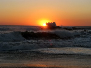pacific ocean sunset with splash