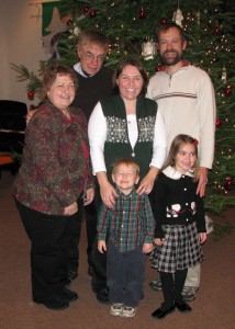 Family picture in front of the Christmas tree after the 5pm service