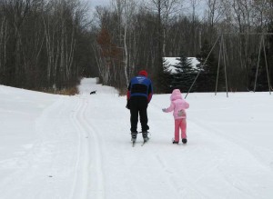 Papa Dale and the snow princess Analise skiing together