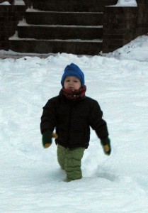 Bundled up and hiking through the snow in our frontyard