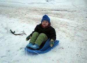 Happy and ready to be pulled down to the sledding hill