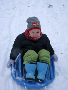 Josiah enjoying being pulled back up the hill