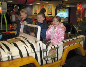 Josiah, Derrick, and Analise hanging out on the jeep