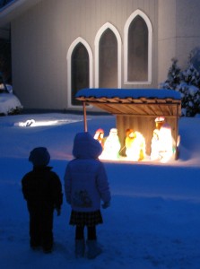 Josiah and Analise look at the Nativity outside Salem Lutheran Church before the 5pm Christmas Eve service
