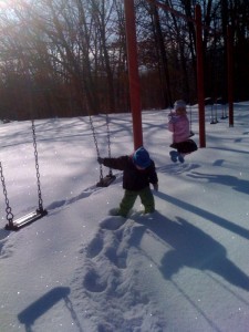 Josiah and Analise on the swings