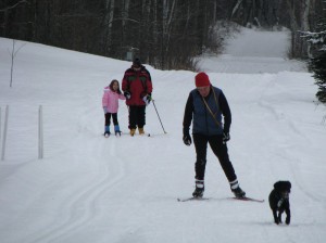 Trying to catch snow flakes while Mommy looks very cold and Dale and Molly ski ahead