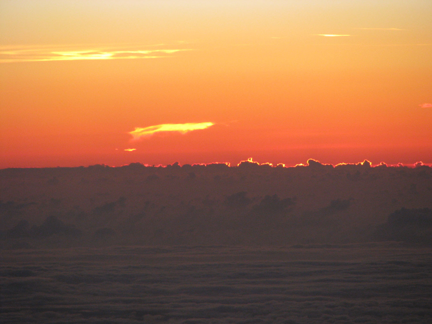 Another close-up view of the sunset sky over the clouds of the Caribbean