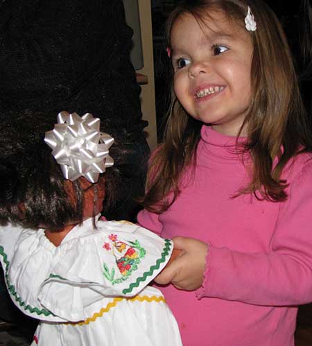 Analise with her Dora doll dressed up in a new dress made in Nicaragua!