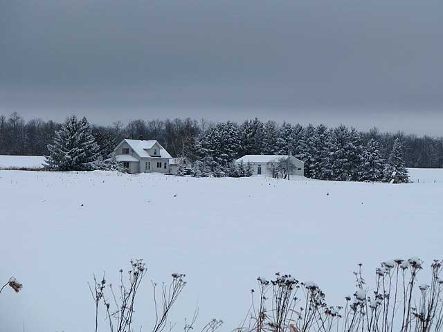 a snowy farm house