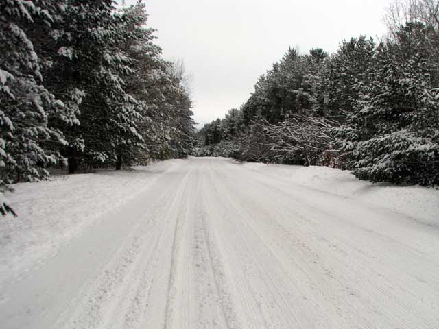 biking down a snowy road