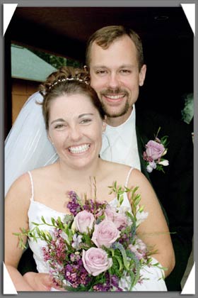 the happily newly married couple upon arriving at the reception